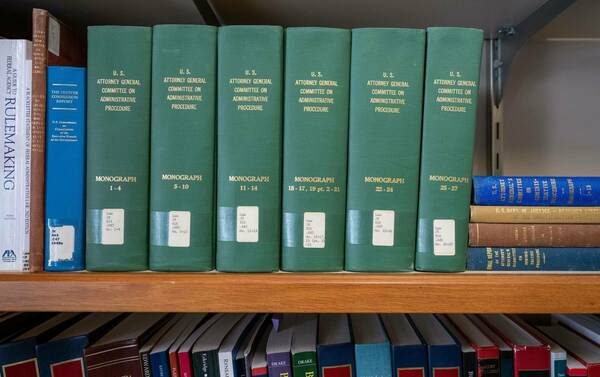 Green law books on a shelf