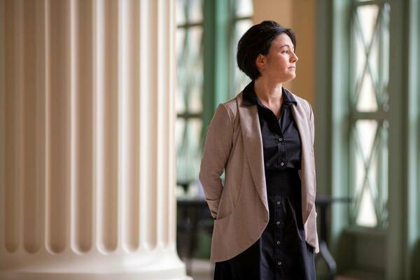 Mari Yoko Hara standing in the halls of the School of Architecture
